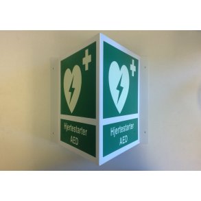 Efterlysende vinkelskilt til placering ved AED/hjertestarter med tekst og piktogram
